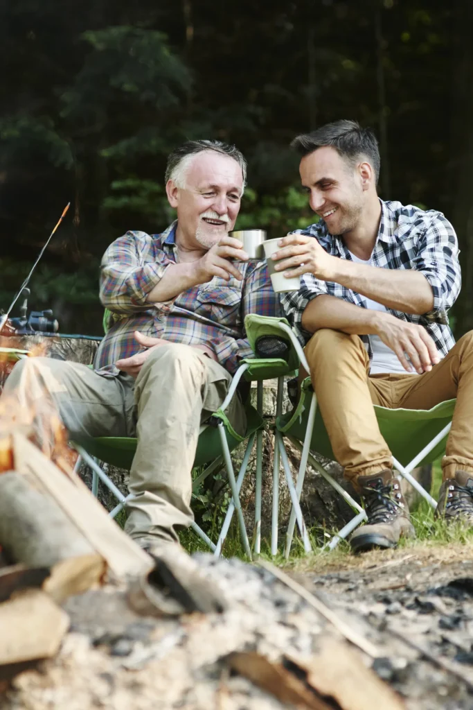 two men fishing and cheersing each other